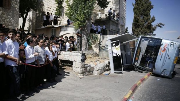 The overturned bus in Jerusalem on Monday.