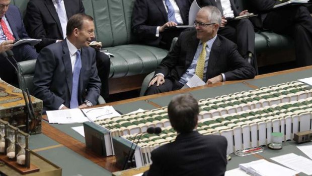 Opposition Leader Tony Abbott and shadow communications minister Malcolm Turnbull listen to Workplace Relations Minister Bill Shorten during question time on Monday.