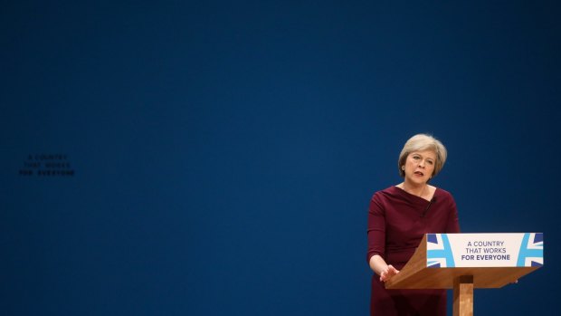 Theresa May, U.K. prime minister and leader of the Conservative party, delivers the closing speech at the party's annual conference in Birmingham, U.K., on Wednesday, Oct. 5, 2016. The pound has fallen 1.8 percent to a 31-year low against the dollar since the start of her Conservative Party's annual conference amid investor concerned that Britain could be heading for a ?hard Brexit,? with little accommodation for the finance industry. Photographer: Chris Ratcliffe/Bloomberg