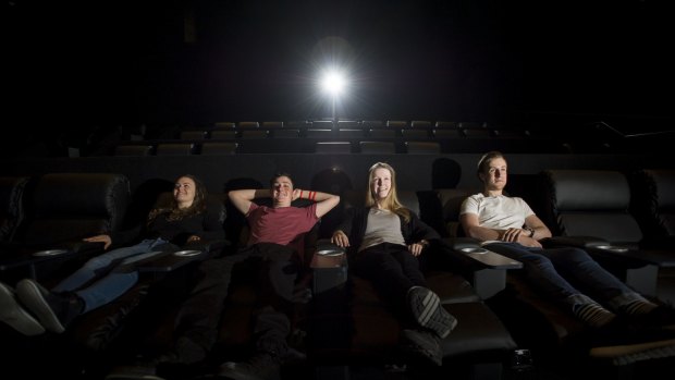 News
Hoyts is slowly rolling out across all of their ACT cinemas comfy, reclining chairs in every row of all of their cinemas. Pictured (l-r) Celeste Booth, Adam Monro, Larissa Butt and Ben Francis
The Canberra Times
Date: 29 October 2015
Photo Jay Cronan