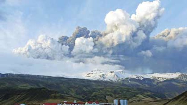 Casting a dark cloud ... volcanic smoke and steam hang over Iceland after the second eruption of the Eyjafjallajokull volcano in a month. Ash forced the closure of British airports.