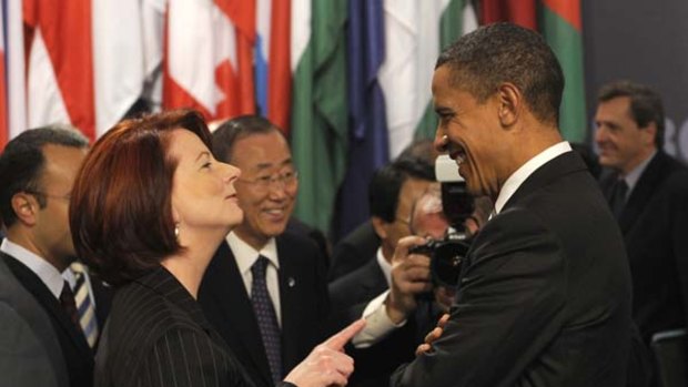 Australia's Prime Minister Julia Gillard chats with US President Barack Obama during the NATO summit in Portugal.