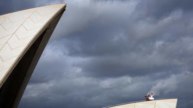 High pointes: Australian Ballet's Amber Scott and Bangarra's Patrick Thaiday atop the Opera House.