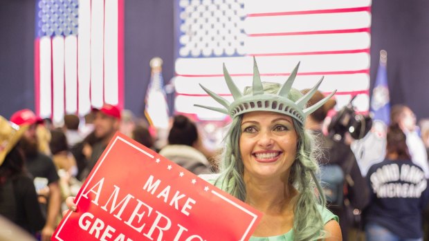 Mary Simcox of Portland, Michigan poses for a photo before a rally by Republican presidential candidate Donald Trump in Grand Rapids.