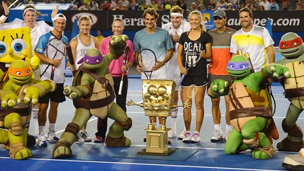 Star power: Teenage Mutant Ninja Turtles upstage the players at Saturday's Kids Tennis Day at Melbourne Park.