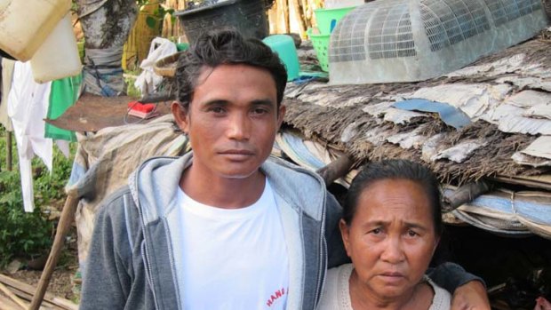 "Please come home" ... Sam's brother Rudi and mother, Asia, on the Indonesian island of Bima, where they live.
