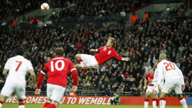 Vital role ... Peter Crouch scored two second-half goals to save face for England.