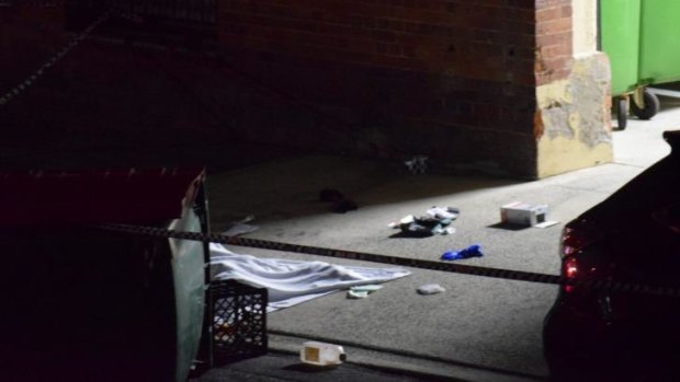 Marcus Volke's body lies covered with a blanket in Dath St, Teneriffe.