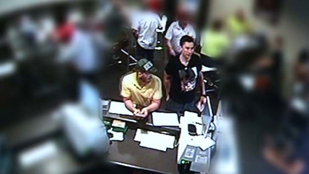 These men were seen placing bets at a hotel on Sturt Street in Townsville.