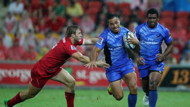 Alfie Mafi of the Western Force makes a break past Dom Shipperley of the Queensland Reds on Saturday night in Brisbane.