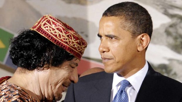 Barack Obama with Muammar Gaddafi.