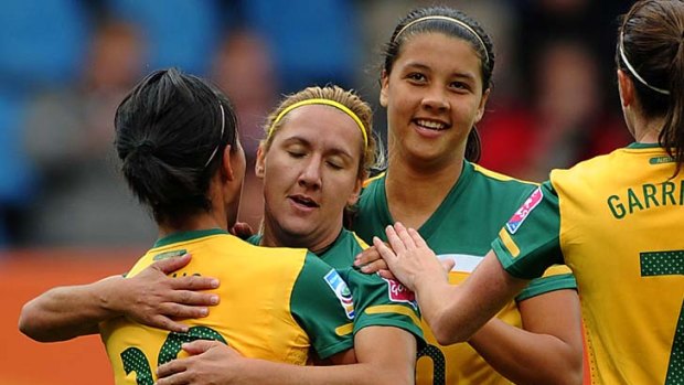 Australian players (L-R) Leena Khamis, Lisa de Vanna, Samantha Kerr and Heather Garriock celebrate after a goal.