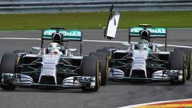 Teammates and rivals: Rosberg's car (R) collides with Lewis Hamitlon's vehicle forcing the British driver to eventually retire from the race.