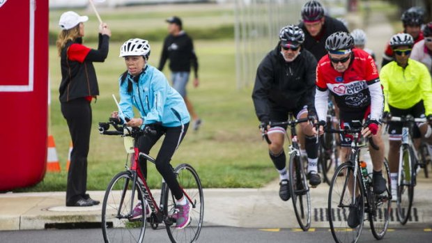 Turia Pitt leads off a group of cyclists from Parliament House on their way to Cooma on a leg of the Variety Cycle to Uluru.