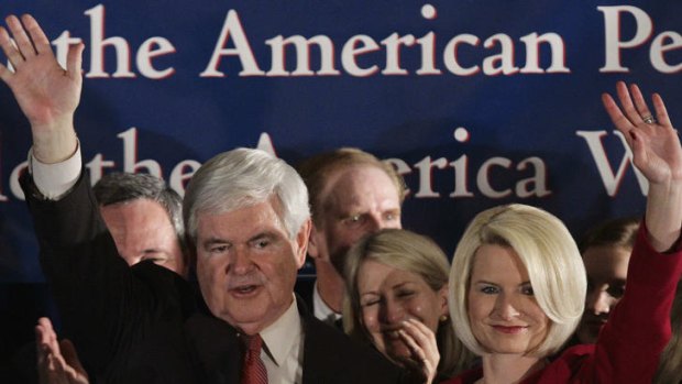 Newt and wife Callista Gingrich wave to the crowd after a South Carolina Republican primary rally.