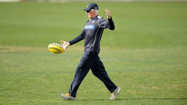 Carlton coach Mick Malthouse gets hands-on at training on Thursday.