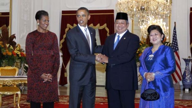 Warm welcome ...  Barack Obama and his wife, Michelle, meet  Susilo Bambang Yudhoyono and his wife, Ani Herrawati,  at the Istana Merdeka in Jakarta.