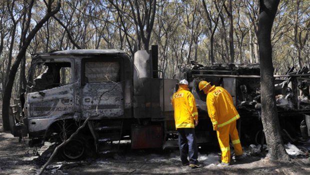 The charred shell of a $350,000 CFA truck near Belgrave Heights.  The tanker  was able to protect three firefighters from an out-of-control bushfire as it burnt over them.