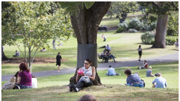 Melburnians bask in the last of the Autumn sun at Flagstaff Gardens.