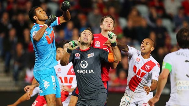 Tough stuff: Adelaide United and Melbourne Heart ended a fiery encounter with a thrilling 2-2 draw on Friday night.