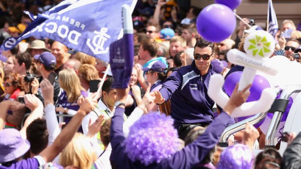 Ryan Crowley of the Dockers waves to the crowd during the 2013 AFL Grand Final Parade.