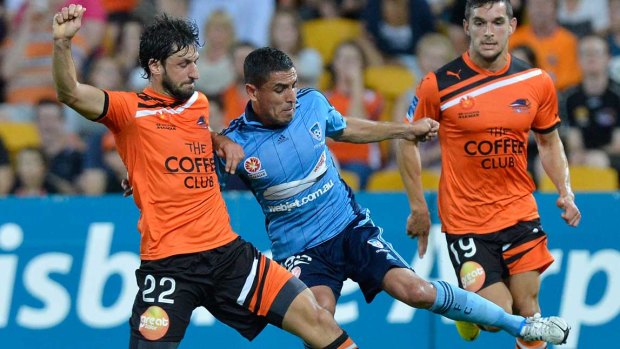 Confidence crisis &#8230; Sydney FC's Ali Abbas is tackled by Thomas Broich of the Roar in the Sky Blues' latest loss on Friday night.