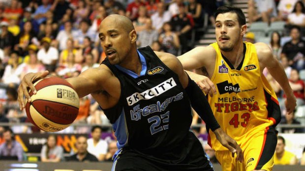 Breakers veteran CJ Bruton gathers a rebound during the round nine NBL match between the Melbourne Tigers and the New Zealand Breakers.
