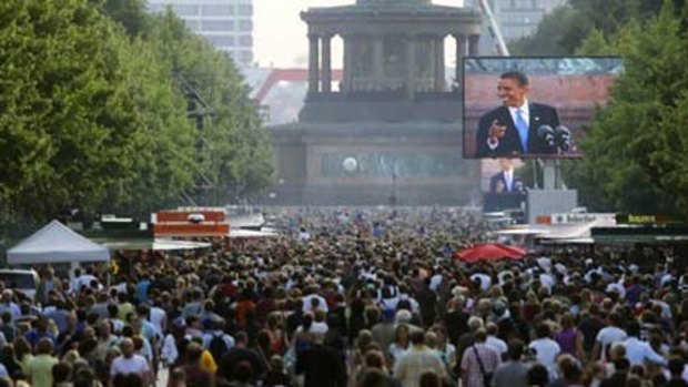 Barack Obama addresses a crowd of 200,000 in front of Berlin's Victory Column.