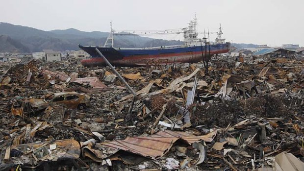 The ship sits among the rubble in the residential neighbourhood.