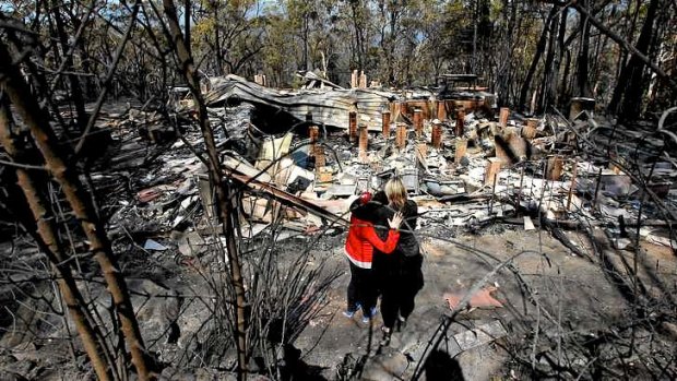 Standing before a home in Winmalee that was destroyed in the fires.