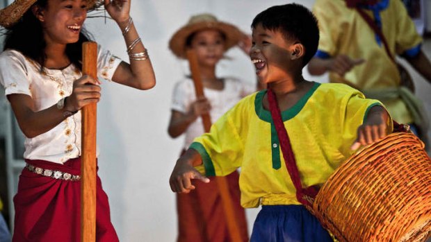 Reaching out: Youths at the Kampot Traditional Music School for Orphaned and Disabled Children put on a show.