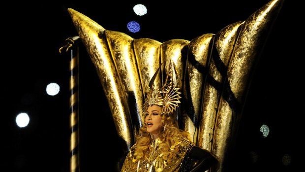Madonna arrives on a golden throne for her Super Bowl performance.