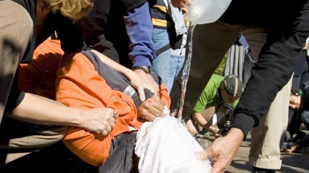 Interrogation method: Protesters demonstrate the use of waterboarding. 