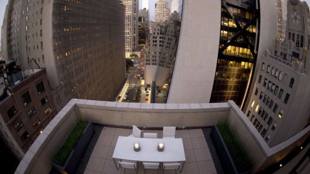 A view of a dining table atop the AKA Central Park Hotel in New York. The room offers a chance to sleep under the stars and the lights of Manhattan.