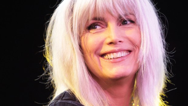 Grey eminence ... Emmylou Harris, 65, keeps her hair long and natural.