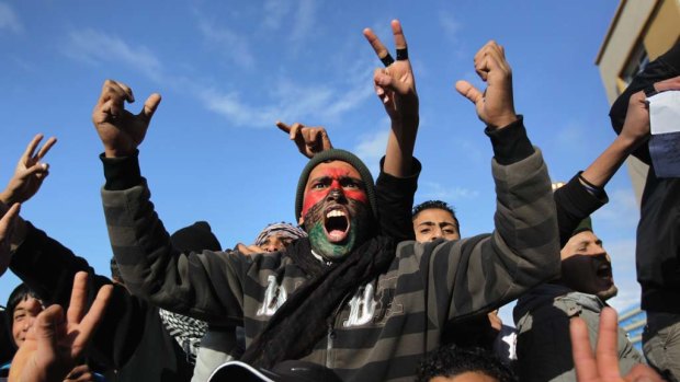 Rage  ... demonstrators demand the removal of the Libyan leader, Muammar Gaddafi, on Thursday. The east of the country has largely fallen  under opposition control.