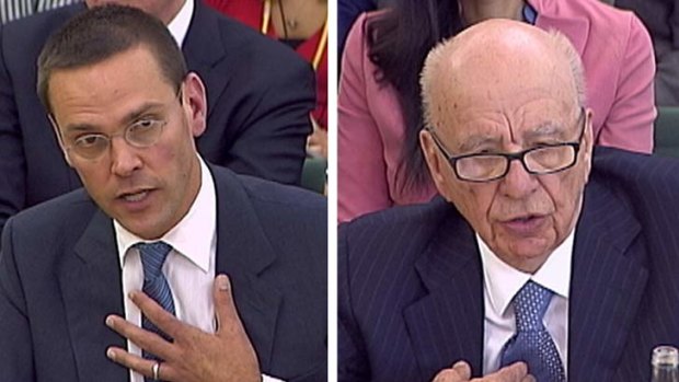 James (left) and Rupert Murdoch answer questions before a panel of  British parliamentarians.
