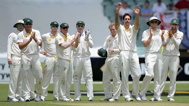 All hail: Mitchell Johnson acknowledges the crowd during his seven-wicket haul at the Adelaide Oval.