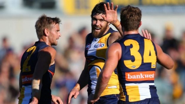 Close call: Josh Kennedy celebrates a goal in the three-point win over the Suns.