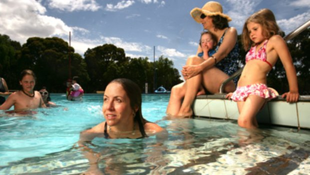 Some of the successful campaigners to have the Coburg Pool reopened, including Claire Wright (centre) and Kitty Owens (in hat), enjoy a dip.