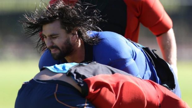 Ripping in: Waratahs forward Jacques Potgieter crashes into a teammate at training during the week. 
