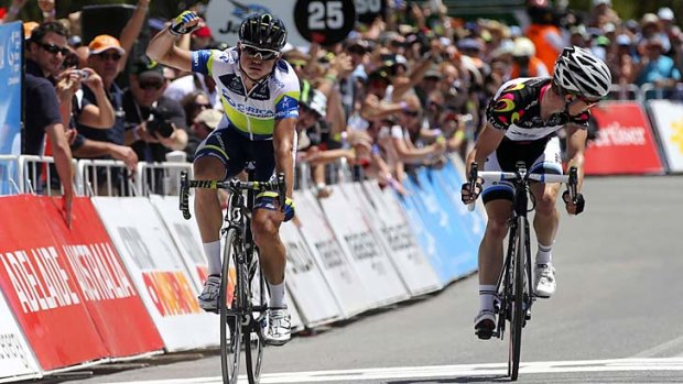 Local hero ... Simon Gerrans wins stage 5 of the Tour Down Under in Adelaide yesterday in front of Tom-Jelte Slagter, who leads the tour overall by 13 seconds and is likely to win.