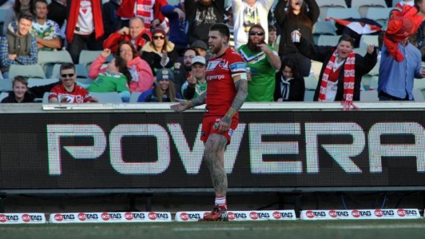 Former Raiders player Josh Dugan gets a varied reaction from the crowd after scoring a try.