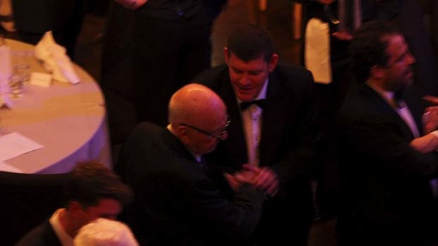 James Packer shaking hands with Rupert Murdoch at the Lowy Lecture