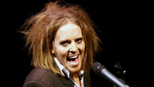 Tim Minchin... Compared to a troll doll by fans.