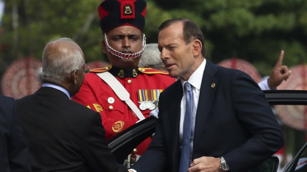 Prime Minister Tony Abbott arrives for the opening ceremony of the Commonwealth Heads of Government meeting in Colombo.