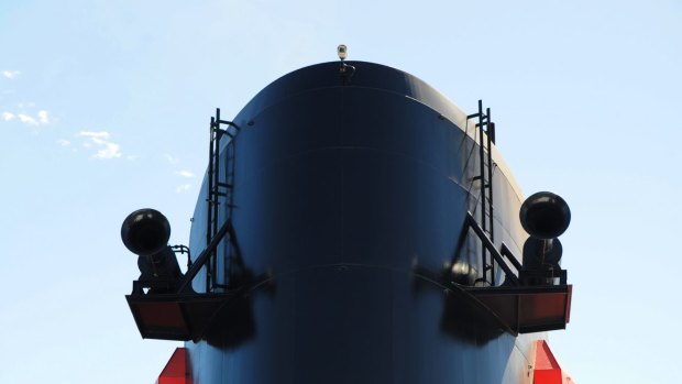 F is for funnel at which  Commodore Christopher Rynd stands on the base of on the Queen Mary 2.
