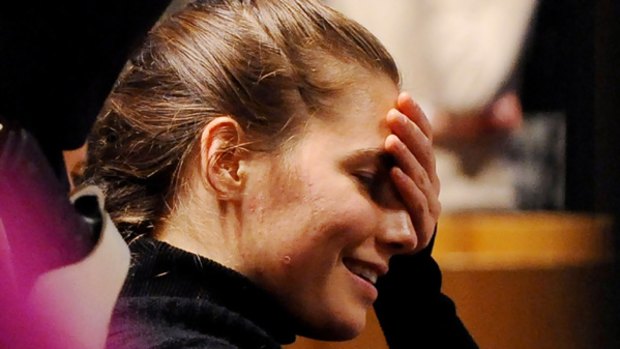 US student Amanda Knox watches on in court.