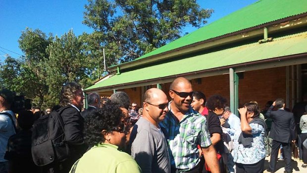 The Quandamooka people celebrate after the Federal Court's decision at a hall at Dunwich, North Stradbroke Island.