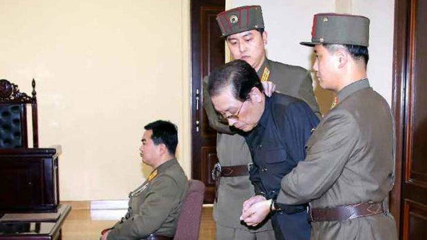 Jang Song-thaek escorted in court on December 12, 2013 before being executed.